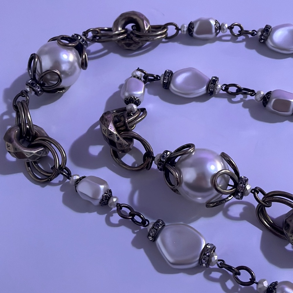 Maryln Schiff multi link necklace with white stones.